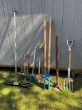 assorted tools, post hole digger, tamper, broom and more