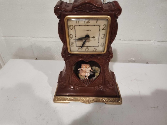 Vintage United Clock Boy Girl Swing 12" tall