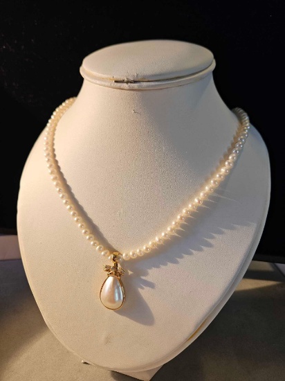 14k gold pearl strand with 14k gold, diamond, and pearl enhancer