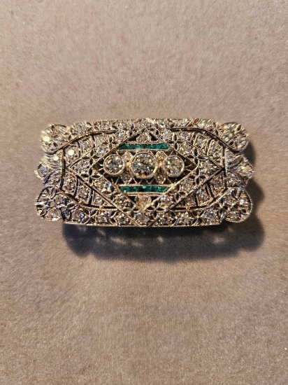 Lady's platinum antique filigree bar pin set with emeralds