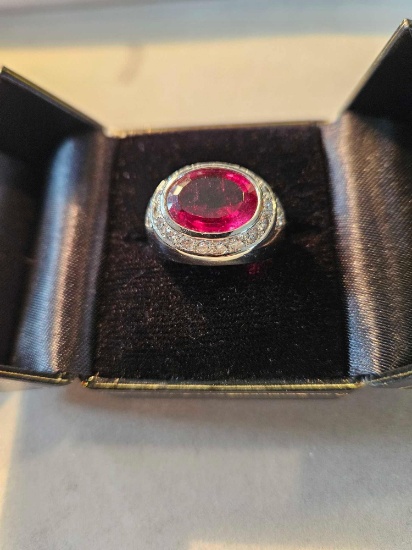 Platinum ring containing a red 15 x 11 mm oval 6 carat rubellite tourmaline