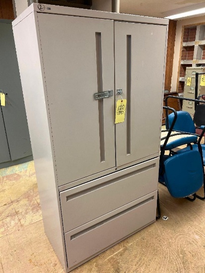 Tan metal storage cabinet with drawers