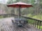 wrought iron patio table w/ 4 chairs & umbrella