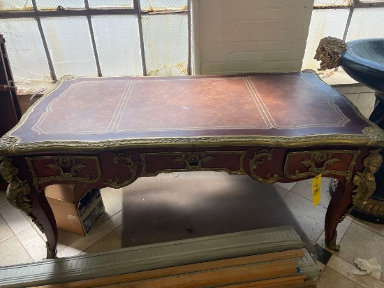 Ornate Carved Wood Table With Figural Accents and Leather Inlaid Top