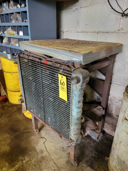 Metal frame shop stand on casters with radiator