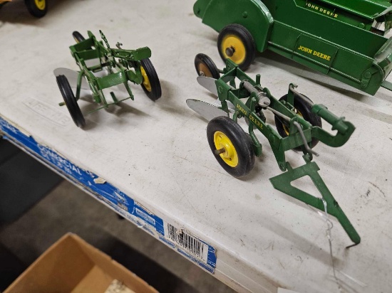 Early JD 2 bottom plows, 1/16th, bid x 2