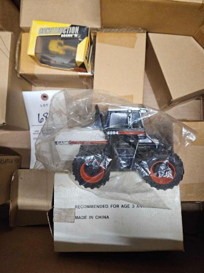 Assorted toys, case 4894 tractor, construction, etc