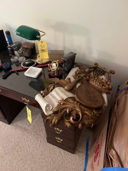 Miscellaneous contents on computer desk and small trash cans