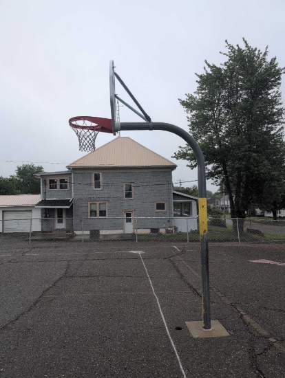 Outdoor basketball hoop cemented in ground