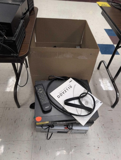 Box lot of assorted DVD/VHS players, power strips and electronics, room 1201