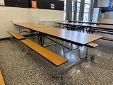 Folding cafeteria lunch table on casters