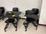 4 adjustable desks on wheels - room 1201