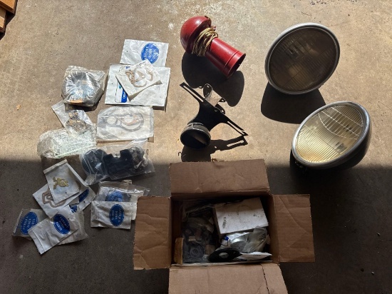 Model A parts; headlights, rear tail plate mount, horn, gaskets etc.