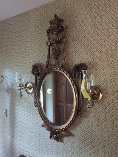 Gold framed ornate mirror with wall scounces