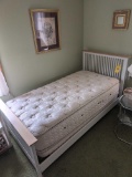 Twin size bed frame with clean mattress and box spring
