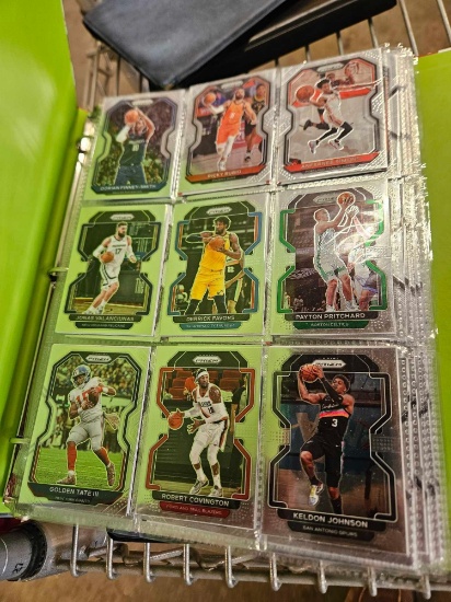 Binders with basketball cards and first day issue stamps