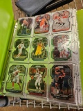Binders with basketball cards and first day issue stamps