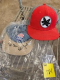 2 hats, one is signed