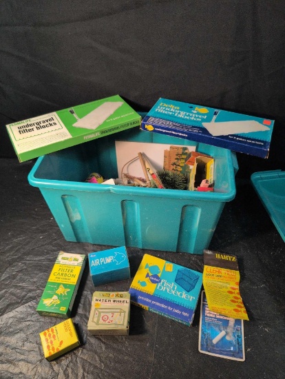 Tote of vintage aquarium items, empty boxes, advertising, tank decor and more