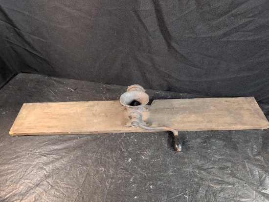 Enterprise meat grinder mounted to board