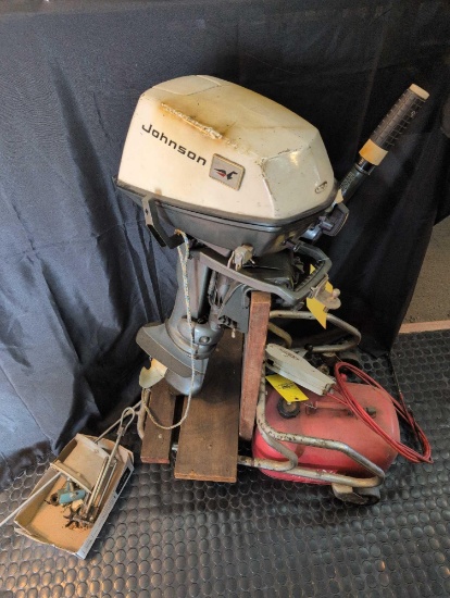 Johnson 6 Hp outboard boat motor with tank, parts, cart and control