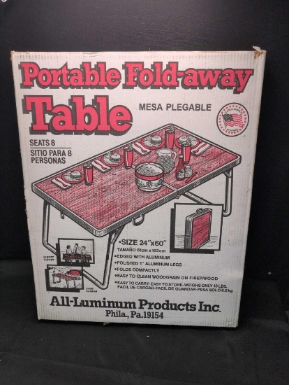 Portable fold away table