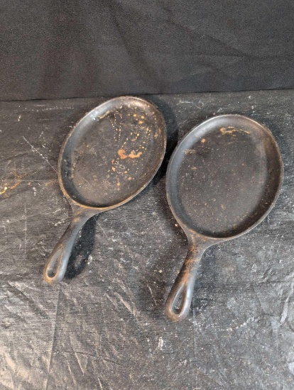 Pair of cast iron oval fajita skillets