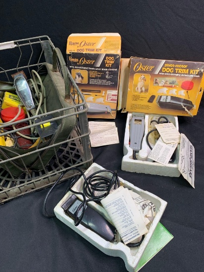 Early milk crate with assorted dog clippers and accessories