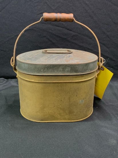 Antique metal lunch pail with trays and pierced bottom