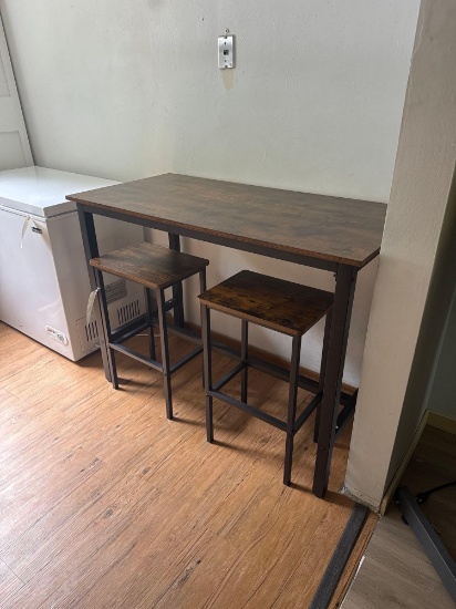 modern bar height table and two chairs