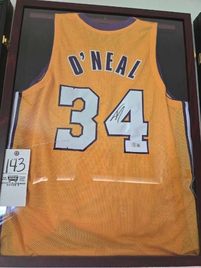 Framed O'Neal Jersey with autograph.