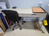 Desk, paper cutter, desk chair