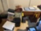 Small wooden desk with a paper shredder, sewing materials, file cabinet, and file dividers