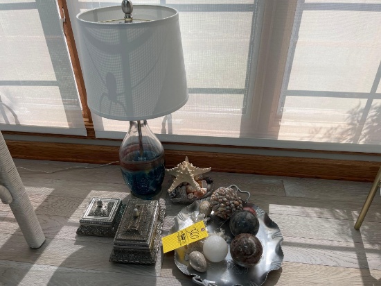 Table lamp, sea shells, and beach decorations