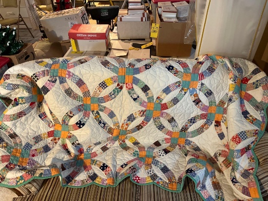 Large colorful handmade quilt by Mary Buchman