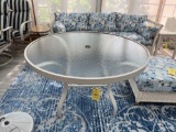 Glass top patio table and an umbrella base and umbrella