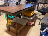 Wooden folding table, blankets, framed photos