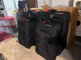 2 sets of American Tourister luggage - 2 large checked bags and 2 carry on bags