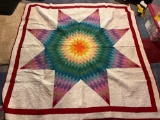 Large colorful quilt handmade by Mary Buchman
