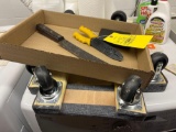 2 dolly carts, drill bits, machete, wire stripper