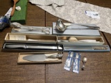 Assortment of silver plated kitchen ware - salad tongs, soup spoon, knives, spoons, cake knife