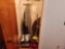Contents of Closet - Sweepers, Ironing Board, Wood Round Folding Table