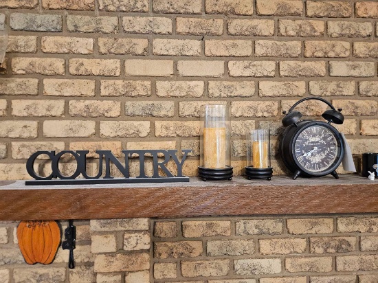 Clock, candles, sign