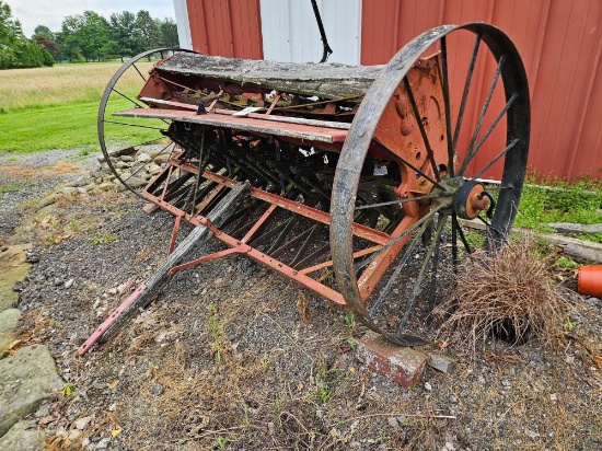 Early grain drill with steel wheels