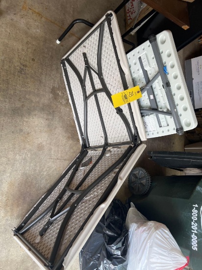 Two folding plastic tables