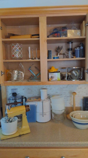 Contents of kitchen cupboards on stove side