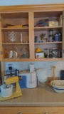 Contents of kitchen cupboards on stove side