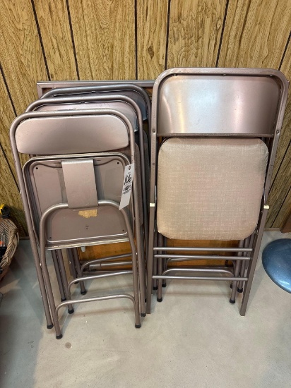 card table and assorted folding chairs