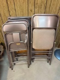 card table and assorted folding chairs