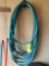3 garden hoses and hanger